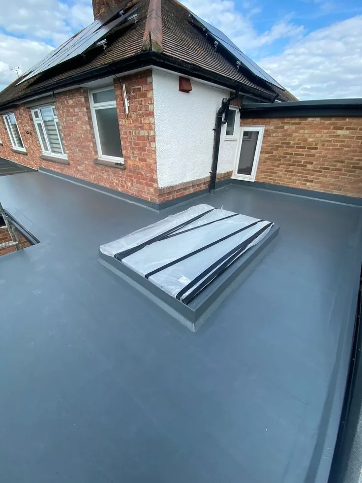 New grey flat roof with a skylight curb in Kanata