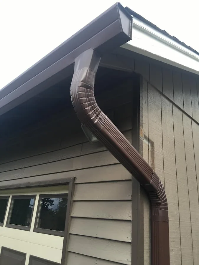 Brown eavestrough and downspout on a garage in Stittsville